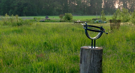 Fototapeta na wymiar Sundial in a dutch meadow