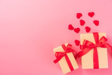 Giving present and celebration concept at Valentine's day, anniversary, mother's day and birthday surprise on pink background, copyspace, topview