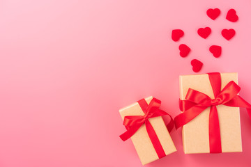 Giving present and celebration concept at Valentine's day, anniversary, mother's day and birthday surprise on pink background, copyspace, topview