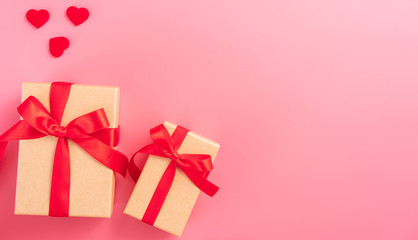 Giving present and celebration concept at Valentine's day, anniversary, mother's day and birthday surprise on pink background, copyspace, topview