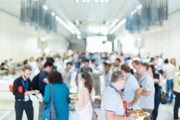 Blured image of businesspeople at coffee break at conference meeting. Business and entrepreneurship.