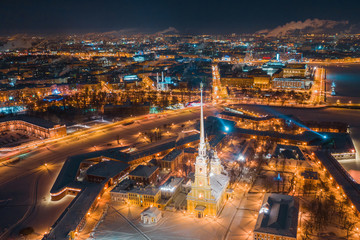 Fototapeta na wymiar Beautiful night view of Saint-Petersburg, Russia, Peter and Paul Fortress with cityscape and scenery beyond the city