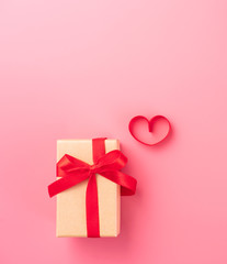 Giving present and celebration concept at Valentine's day, anniversary, mother's day and birthday surprise on pink background, copyspace, topview
