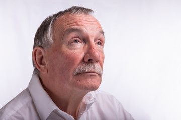 Senior man on white background with copy space 