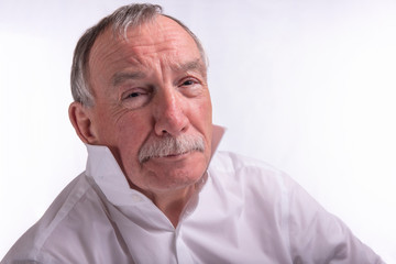 High key portrait of senior man, taken with copy space 