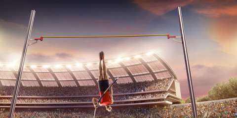 Young male pole vault athlete with pole bar. Men in sport clothes jump over the pole bar at...