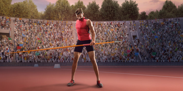 Young male javelin thrower throwing a spear. Athlete in sport clothes at athletic sport track in professional stadium