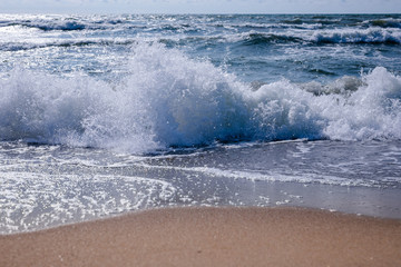 Empty beach, waves and dramatic sky at the Baltic sea shore line, Lithuania, Klaipeda
