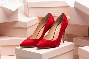 New red leather high heel shoes on the box - Powered by Adobe