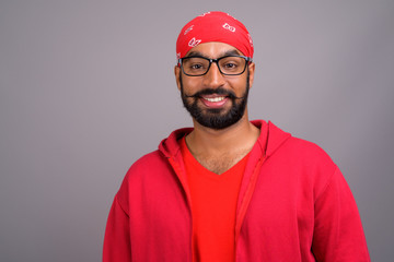 Portrait of happy young Indian man smiling