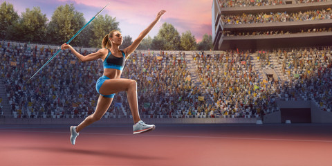 Young black female javelin thrower throwing a spear. Athlete in sport clothes at athletic sport track in professional stadium - obrazy, fototapety, plakaty