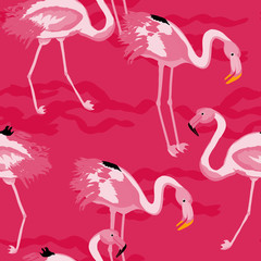 Fototapeta premium Tropical seamless pattern with flamingos.Summer background with bird. Exotic seamless pattern with pink flamingo.