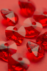 Red heart crystal on red paper, valentine's background