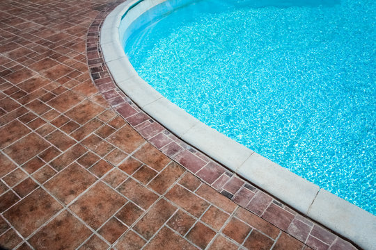 Beautiful swimming pool at the seaside hotel in park background