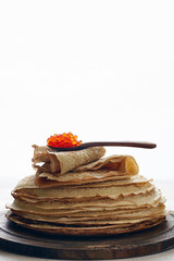 Stack of russian thin pancakes blini with red caviar. Shrovetide Maslenitsa festival meal