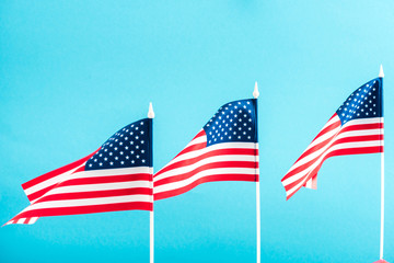 background of american flags isolated on blue