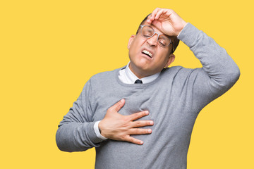 Middle age bussines arab man wearing glasses over isolated background Touching forehead for illness and fever, flu and cold, virus sick