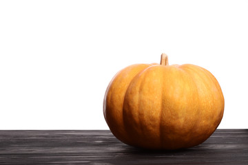 Pumpkin on the brown wooden. Pumpkin seeds on the plate. Copy space