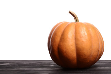Pumpkin on the brown wooden. Pumpkin seeds on the plate. Copy space