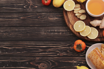 Traditional medicine. Honey and bee honeycombs. Ginger and lemon. Healing tea. Ingredients for tea. Tea with lemon and ginger. Honey for tea. Copy space. Design elements.