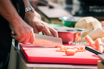 Chefs at work in a restaurant kitchen making delicious food