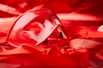 red mask and red ribbons