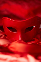 red mask and red ribbons