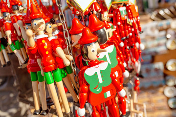 pinocchio puppets toys for sale at touristic shop as souvenirs from Italy
