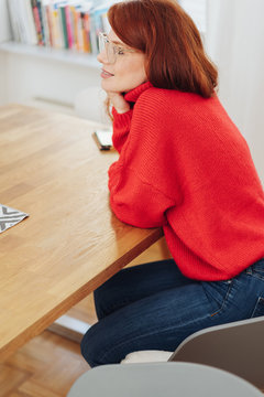 Attractive young redhead woman wearing glasses