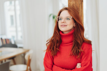 Young woman standing thinking and planning