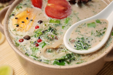 Tasty Chinese soup in pot, closeup