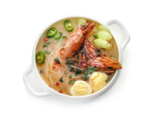Tasty Chinese soup in pot on white background