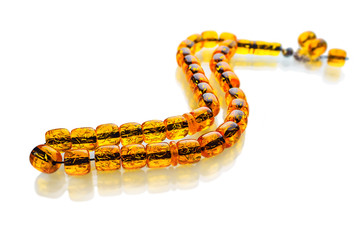 Ramadan Karim greeting background Islamic prayer bead (rosary). Rosary of amber. Ramadan Kareem beautiful poster, banner, postcard for the celebration of the festival of the Muslim community