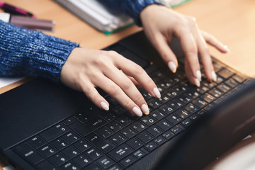 woman using laptop, searching web, browsing information, having workplace at home / soft focus picture / Vintage concept