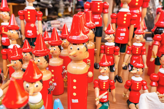  pinocchio puppets toys for sale at touristic shop as souvenirs from Italy