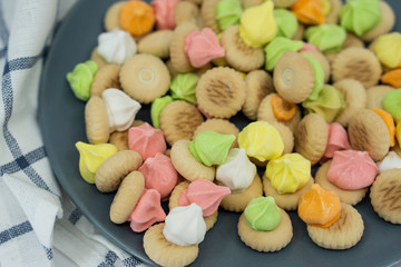 Sugar cookies on a grey plate isolated on white background.