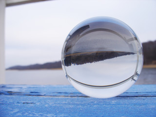 Fototapeta na wymiar Glass ball on the lake