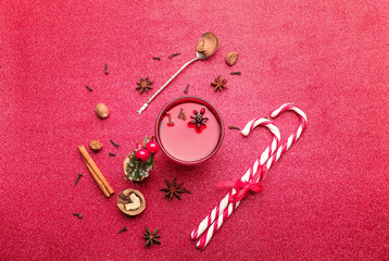 Composition with cup of tasty mulled wine on color background