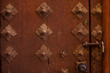 beautiful wooden door. Texture of vintage wooden door and door hammer