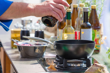 Chefs at work in a restaurant kitchen making delicious food