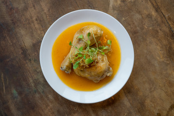 Ginger Chicken Against Wood Background Top Down View / Gourmet Vietnamese Food