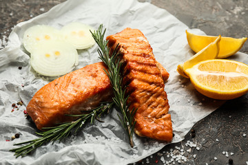 Pieces of tasty grilled salmon on table