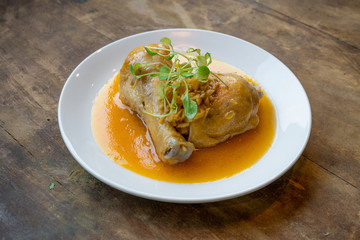 Ginger Chicken Against Wood Background / Gourmet Vietnamese Food