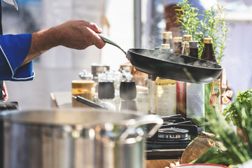 Chefs at work in a restaurant kitchen making delicious food