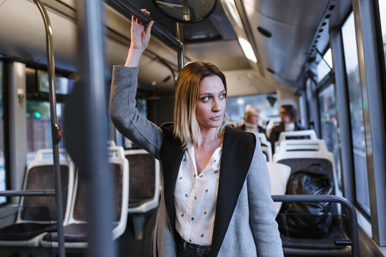 Front View Of Business Woman Traveling On A Bus