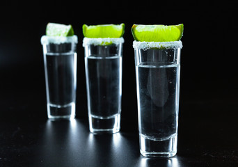 Mexican Tequila in short glasses with lime and salt