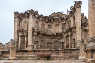 Fototapeta premium Nymphaeum located on Cardo Maximus street in the great Roman city of Jerash - Gerasa, destroyed by an earthquake in 749 AD, located in Jerash city in Jordan