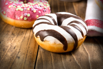 Sweet, delicious American donut, donut on table close up