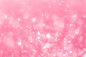 abstract bokeh light effect with soft pink background