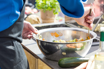 Chefs at work in a restaurant kitchen making delicious food